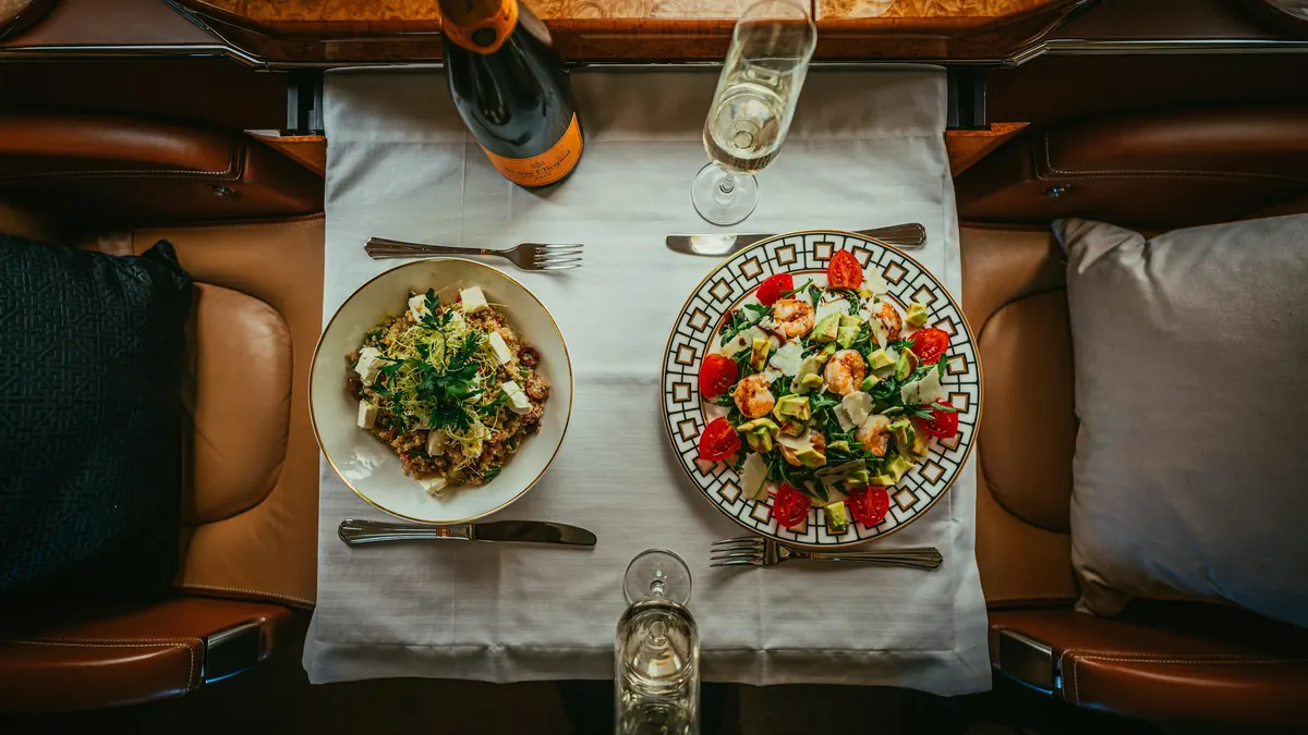 A dinner table set for two, seen from above