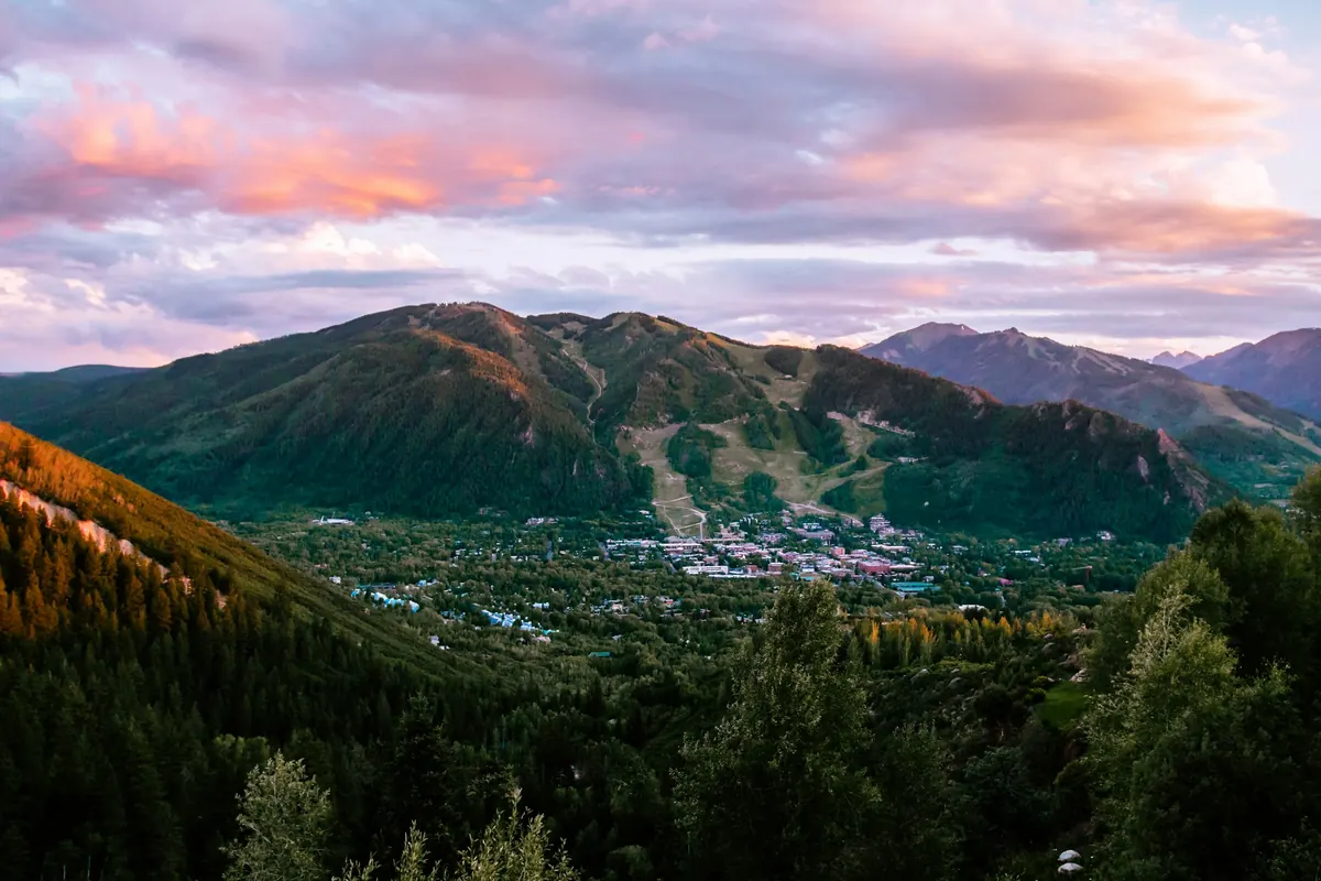 Aspen at sunset with the mountains behind